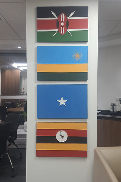 Corporate wall branding and collectible art installed in an office