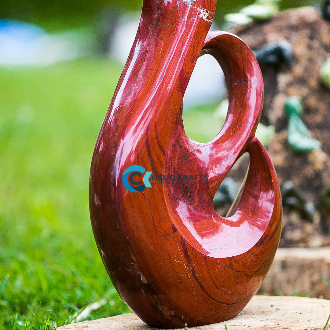 Hand-carved wooden sculpture vignette with minimalist furniture